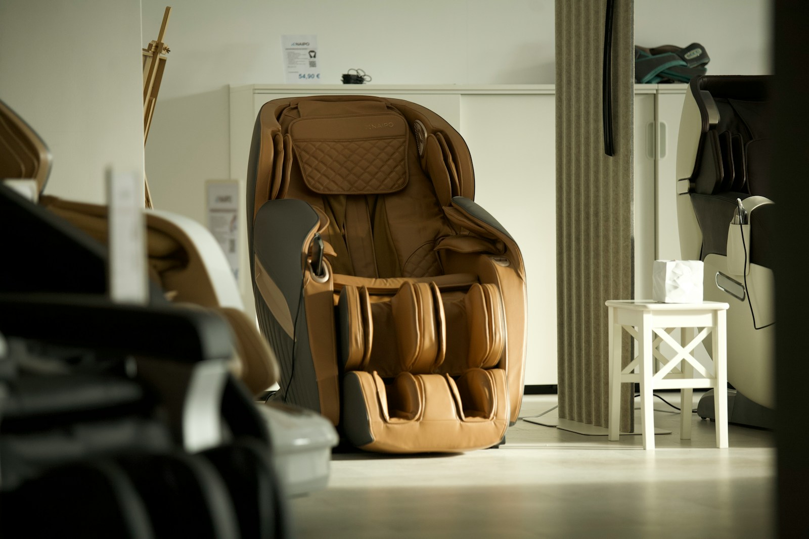 brown and black leather backpack on white wooden table